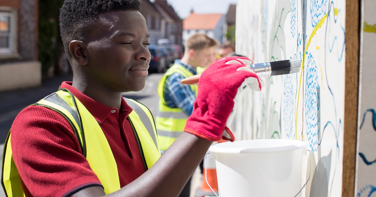 Community volunteers working together on school renovation project
