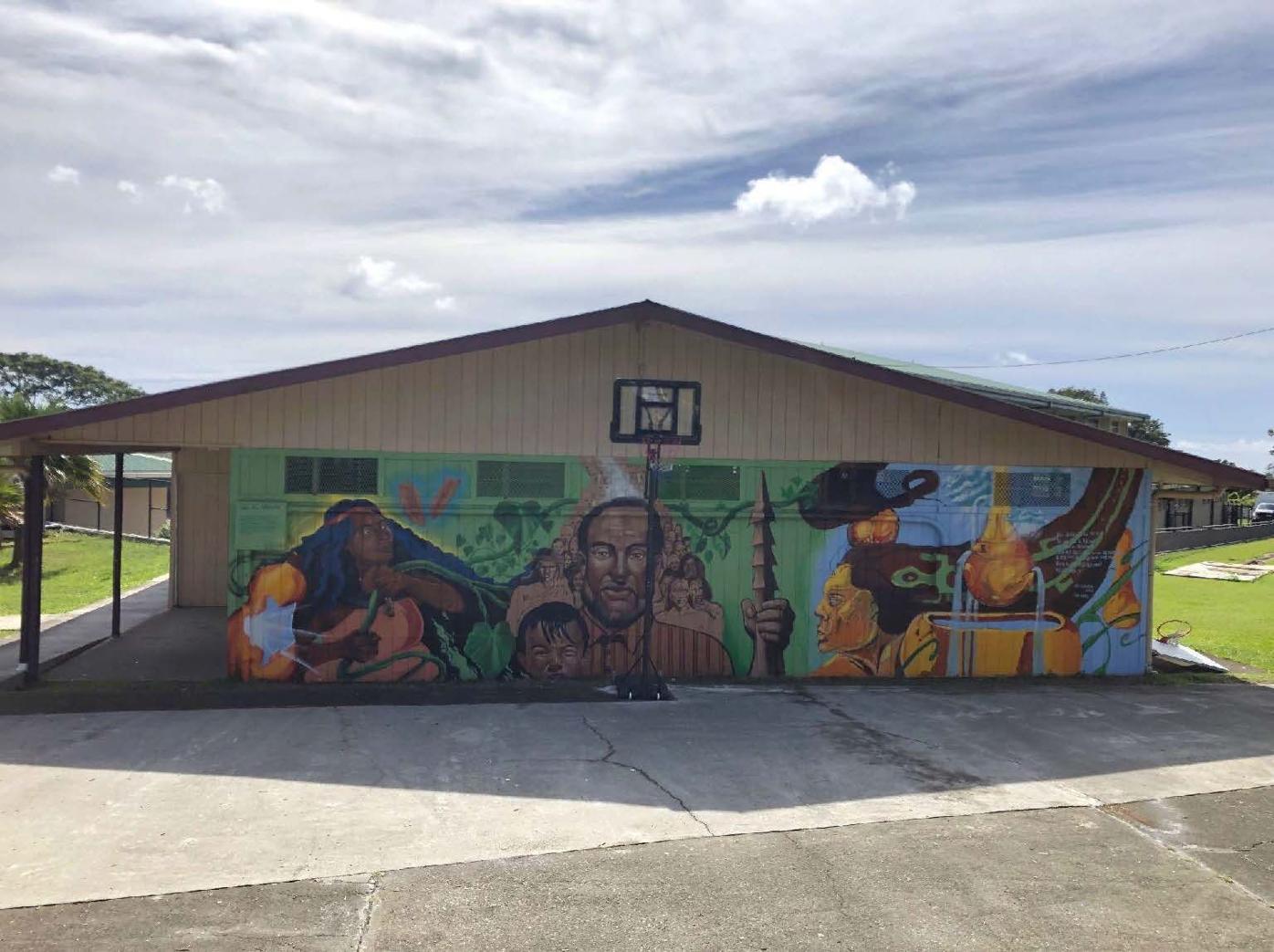 Renovated school building with community mural