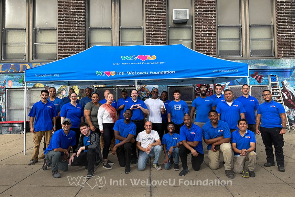 Volunteers painting and repairing school facilities